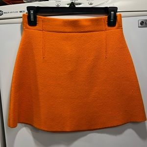 Orange knit skirt by Zara, S